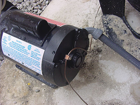 Photo 4. Bonding conductor (8 AWG solid CU) to pool pump motor.