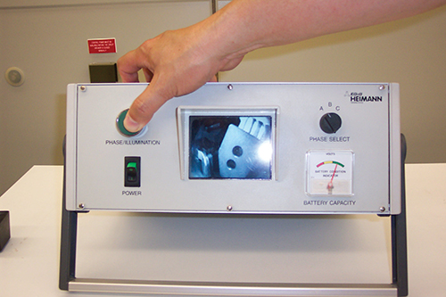 Photo 8. A monitor showing the open blade of an SF6 switch.