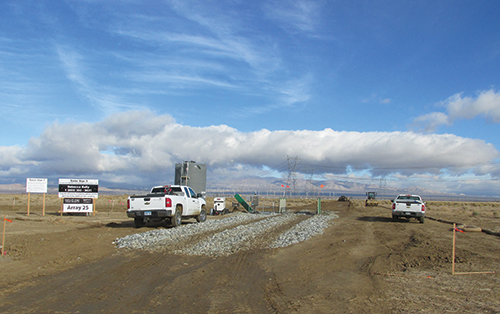 Photo 16. One requirement by the fire marshal was to have the main entrance, fire access road, and water tank(s) completed before the main construction began.