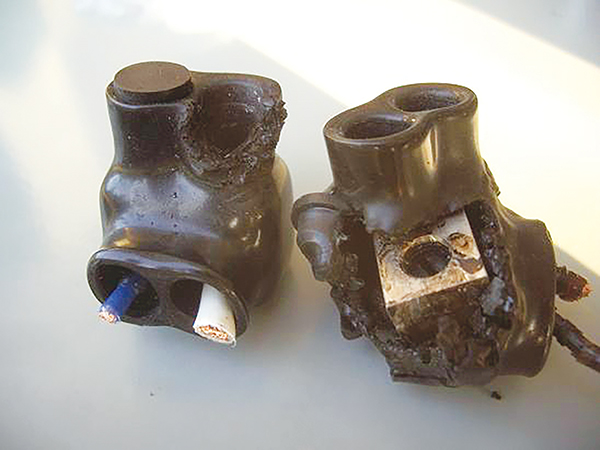Photo 3. Improperly torqued splicing device has melted.
